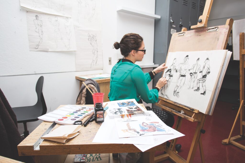 woman drawing at an easel