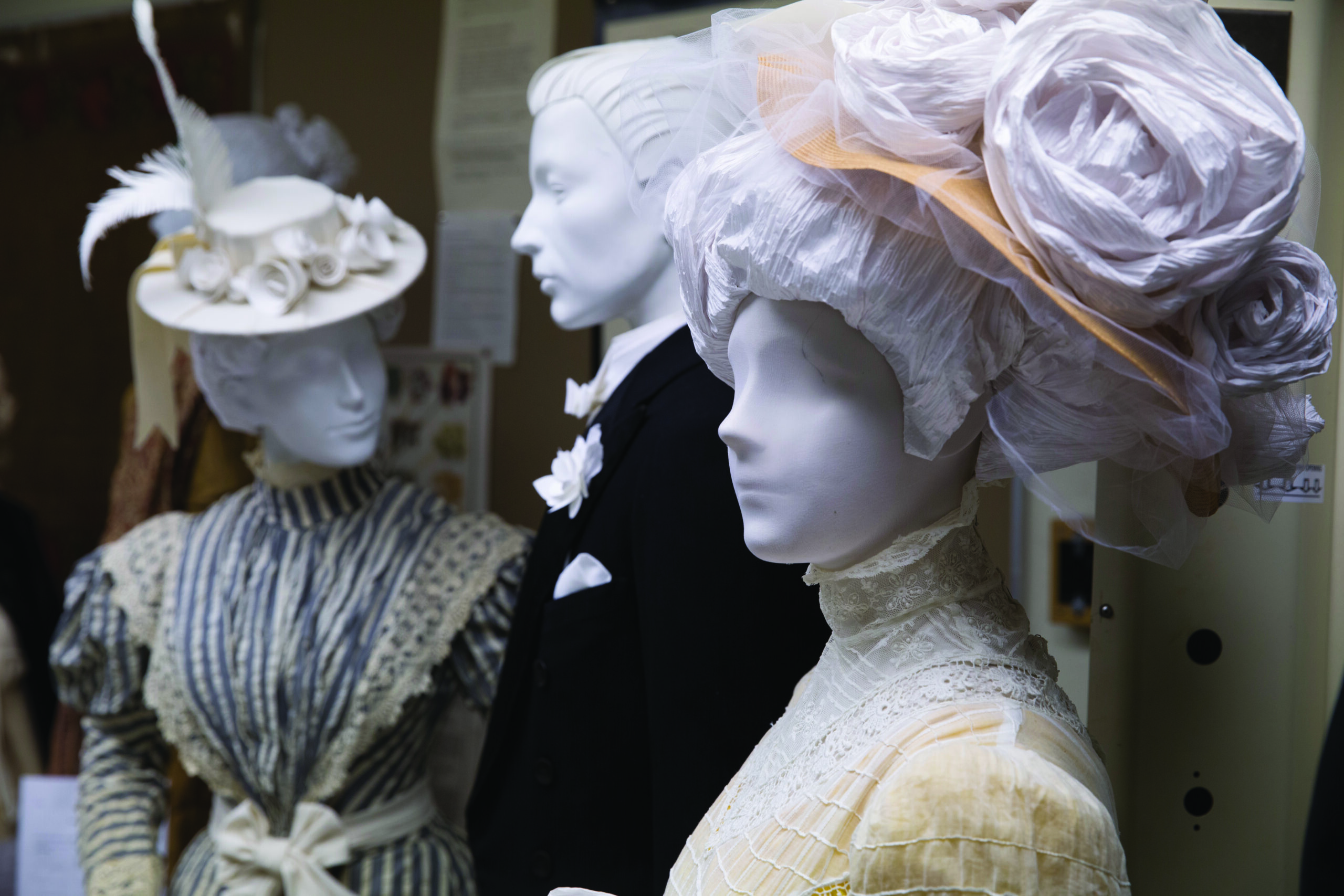 three mannequins styled in period wear